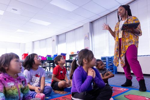 A teacher addresses students